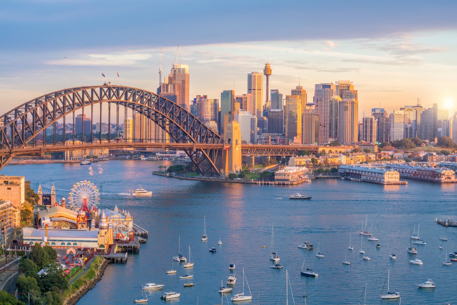 Sydney Harbour Bridge and city skyline at sunset