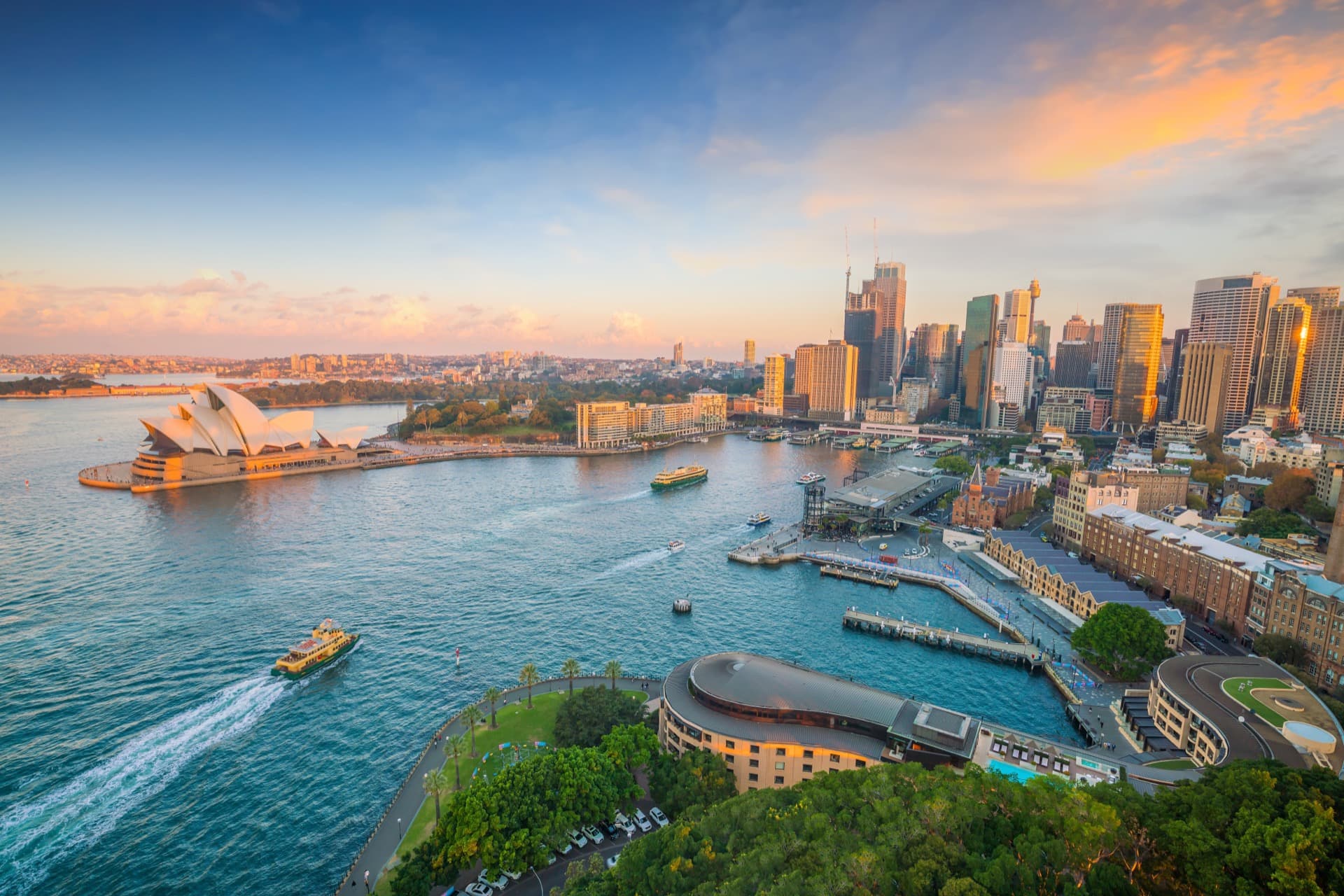 Aerial view of Sydney Harbour, the Opera House, and the city skyline